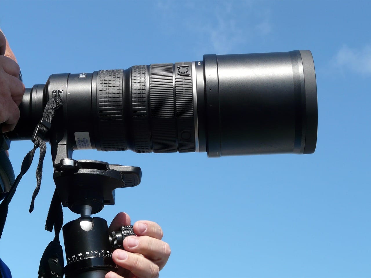 The long lens, taped to the window frame so it would not touch the glass.